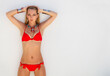 Sexy young blond fashionable woman in a red bikini