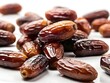 © Elite Elegance - photo close-up sweet dried dates on white background.