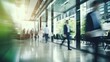 © FoxTok - Blurred background business people walking in the hall of modern glass office, business center, shopping center, bank. Business concept, modern interior with living green plants. Eco style