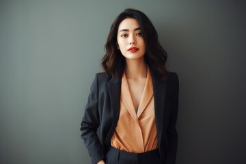 Wall Mural - Portrait of a glad asian woman in her 20s wearing a professional suit jacket against a modern minimalist interior. AI Generation