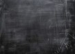 A detailed shot of a dark grey textured surface that emulates the look of a blackboard or slate with subtle variations in shading and light. Ai generated