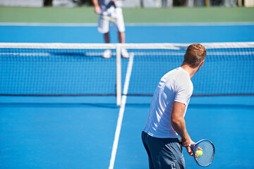 Tennis, game and men with fitness, challenge and competition with training and exercise. Players, friends and guys with rackets and court with workout and sunshine with a match and cardio with a ball