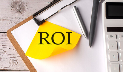 Poster - ROI word on yellow sticky with calculator, pen and clipboard