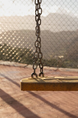 swing on the playground, mountain range