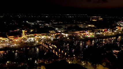 Canvas Print - River Boats in Hoi An Old Town at Night.  Vietnam.  4k Aerial Drone Footage