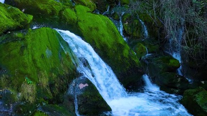 Wall Mural - Waterfall and landscape at the source of the Cadagua River in the surroundings of the town of Cadagua in the Mena Valley. Las Merindades region. Province of Burgos. Spain. Europe