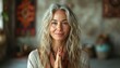 Pretty mature 50 year old woman in a yoga pose, fitness influencer, attractive cute face. Meditation senior female background concept.