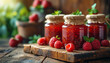 Raspberry jam with berry on light background. Homemade jam with raspberry. banner, menu, recipe place for text, top Various jams peach and strawberry on wooden table