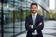 © CogniLens - Portrait of a happy man in his 30s dressed in a stylish blazer against a sophisticated corporate office background. AI Generation