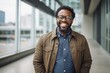 Portrait of a joyful afro-american man in his 30s sporting a rugged denim jacket against a sophisticated corporate office background. AI Generation