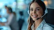 © khwanchai - happy female contract service representative telemarketing operator smiling to camera. Happy beautiful woman call center agent or salesman wearing headset working in customer support office