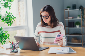 Poster - Photo of intelligent accountant girl hold smart phone use wireless laptop it project business center office indoors