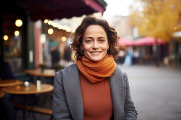 Wall Mural - Portrait of a content woman in her 40s wearing a thermal fleece pullover against a bustling restaurant background. AI Generation