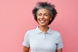Portrait of a blissful afro-american woman in her 60s wearing a sporty polo shirt against a pastel or soft colors background. AI Generation