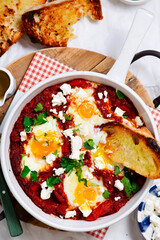 Canvas Print - Shakshukka with feta and bread.traditional moroccan dish. selective focus. hugge style