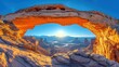 the sun shines brightly through an arch in a rocky outcropping, with a view of a valley and mountains in the distance in the foreground.
