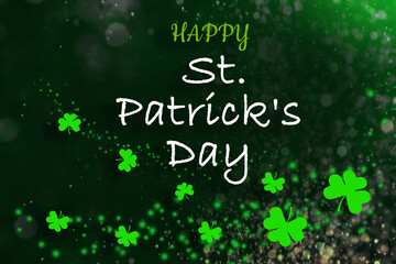 happy st. patrick's day card. clover leaves on dark green background, bokeh effect