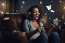 Portrait Of A Happy Woman Holding Money In Her Hands And Sitting In An Armchair.