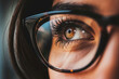 Close-up of a woman's eye with glasses. Selective focus.