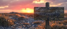 A Rustic Wooden Sign Post Stands Tall Against The Fiery Sky Of A Winter Sunset, Marking The Way To A Tranquil Outdoor Landscape Filled With Rolling Clouds, Golden Fields, And Vibrant Plant Life