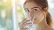young woman is drinking a glass cup of water in the morning,  Health, wellness