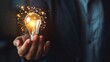 © Orxan - Businessman hand holding creative light bulb with industry network, analysis solution and development marketing network icons planning strategy, Modern business, Innovative of new ideas