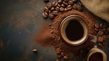 Coffee Cup Surrounded By Ground Coffee And Beans On A Dark Surface
