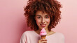 Beautiful woman looking at camera and holding ice cream