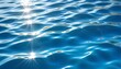 Serene water with a sun reflection. Underwater blue ocean, a swimming pool, or an idyllic panoramic background.	