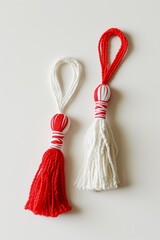 Wall Mural - Red and white Martisor, Martenitsa tassel symbolizing springs arrival on white isolated background. Traditional Moldavian, Romanian, Bulgarian 1 March