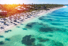 Sunset Or Sunrise On Tropical Beach With Resorts, Palm Trees And Caribbean Sea. Dominican Republic. Aerial View