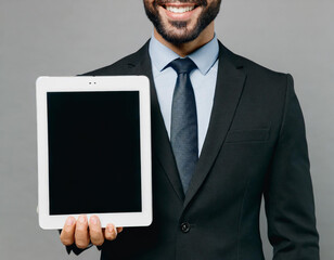 Wall Mural - Close up cropped adult employee business man corporate lawyer in classic formal black suit shirt tie work in office hold use blank screen digital tablet pc computer isolated on plain grey background