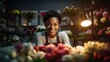 portrait of young african american worker looking at camera among flowers in florist shop