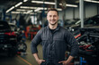 © Tigarto - Smiling Caucasian Auto Mechanic at Garage