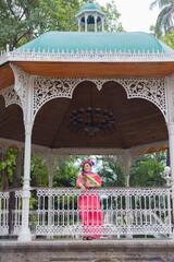 Wall Mural - Mexican woman wearing traditional dress with multicolored embroidery. Woman celebrating the Cinco de Mayo.