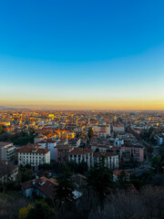 Wall Mural - Sunset over the city of Bergamo. View from Citta Alta Bergamo, Italy