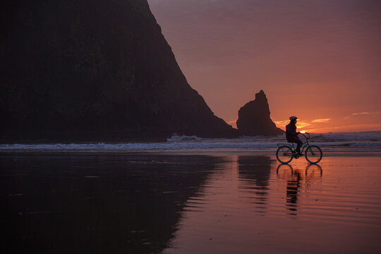biking at sunset on the beach