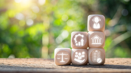 Wall Mural - Social work concept. Wooden block on desk with social work icon on virtual screen. Society, Psychology, Social Justice, Sociology, Improvement, Economics, Community Development, Government.