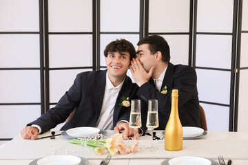 Poster - Happy gay couple at table on their wedding day