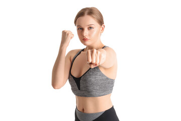 Young woman training on white background. Concept of self defense