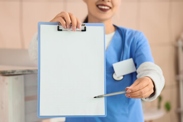 Sticker - Female medical intern with clipboard in clinic, closeup