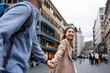 © Kawee - Asian young man and woman shopping goods outdoors in department store.