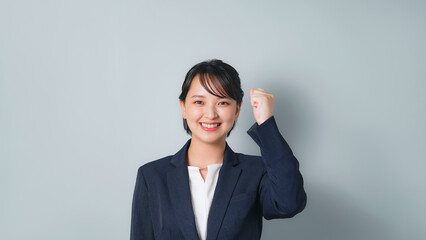 Poster - ガッツポーズするビジネススーツを着た女性