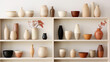 Stylish and minimalist ceramic vases collection on white shelves, showcasing various shapes and textures.