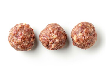 Wall Mural - Three homemade meatballs from above on white background
