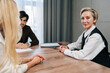 © dikushin - Portrait of middle-aged 50s businesswoman smiling looking at camera posing in boardroom during formal meeting, proud of business growth and achievements. Concept of leadership, careerism, success