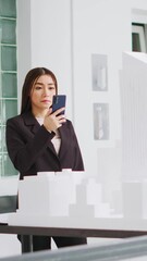 Poster - Vertical Video Architect scanning 3d building model on smartphone to check measurements and architectural scales, small business office. Designer using cad software on phone to work on remodeling