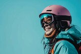 Young smiling woman wear warm padded windbreaker jacket hat ski goggles mask hold snowboard look aside on area travel rest spend weekend winter season in mountains isolated on plain blue background