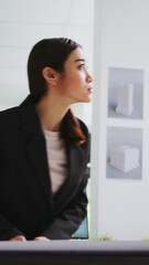 Poster - Vertical Video Real estate agency worker drawing blueprint sketch, getting creative with architectural house remodeling for customers. Asian technician studying 3d building maquette, unicorn business.