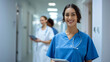 © MP Studio - female healthcare professional in blue scrubs with a stethoscope around her neck